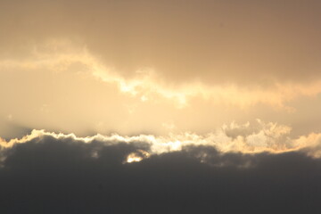 Morning sunrays with sun and clouds