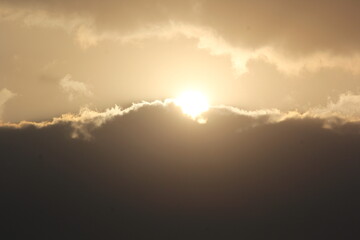 Morning sunrays with sun and clouds