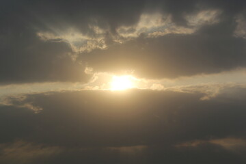 Morning sunrays with sun and clouds