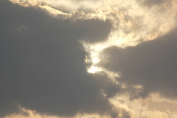 Morning sunrays with sun and clouds