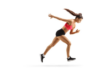 Full length profile shot of a young female athlete running