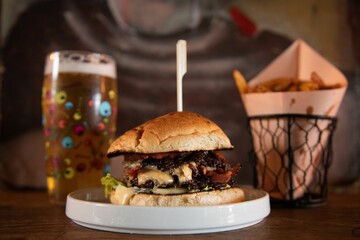 Delicious hamburger, french fries, and beer
