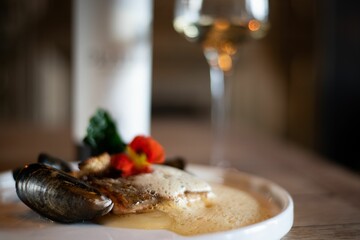 Selective focus shot of a beautifully served clams dish