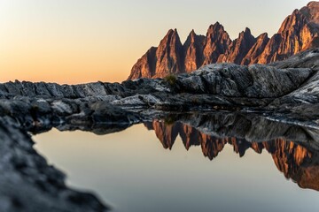 Scenic view of Devils teeth mountains in Senja, Norway, at bright sunset