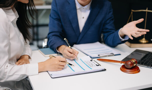 Business and Male lawyer or judge consult having team meeting with client, Law and Legal services concept.Customer service good cooperation ie