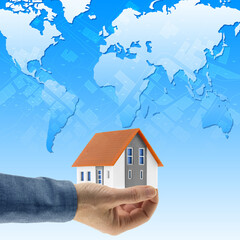 Building activity, construction industry and housing development throughout the world - Concept with home model, global and cadastral map - International real estate market concept