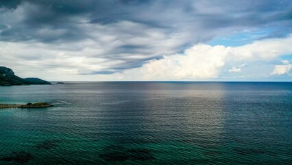 Scenic view of blue cloudy sky over peaceful seascape