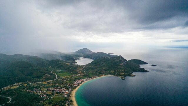 Aerial view of the coastal village and Toroni beach in Sithonia, Halkidiki, Greece