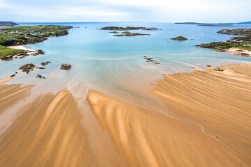 Aerial view of the sandy shore before the seascape in Donegal - obrazy, fototapety, plakaty