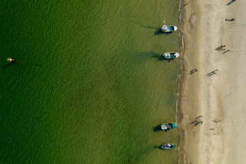 Aerial view of the Baltic sea beach with people and boats in Sopot, Poland