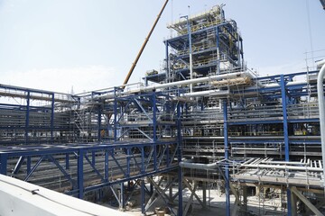 Aerial view of refinery under blue sky