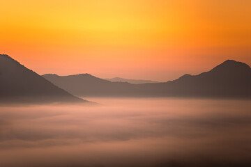 Fototapeta na wymiar Sea of Mist with Light of the morning above Mountains from viewpoint at Phu Thok, Chiang Khan, Loei, Thailand.