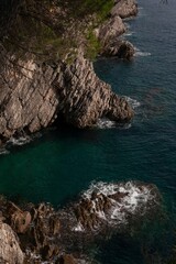 Scenic rocky coastline in Petrovac, Montenegro at sunset