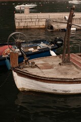 Obraz premium Closeup of two old boats in the port of Petrovac, Montenegro