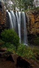 Landscape ong exposure of Trentham waterfalls road in Victoria, Australia, Vertical shot