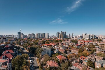 High-angle view of city full of skyscrapers under the blue sky.