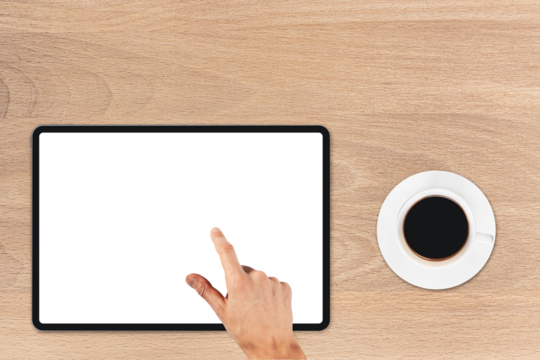 the tablet is on the wood table