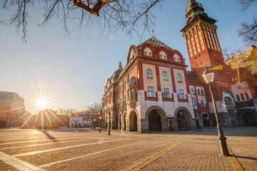 panoramic view of Subotica Town Hall as a focal point of the cityscape, its intricate decoration...