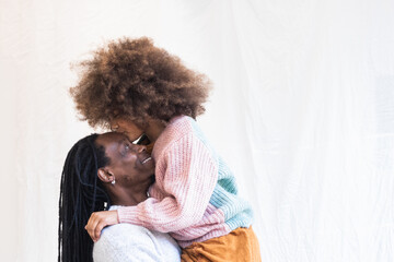 African american girl kissing her dad