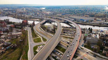 Drone photo of Szczecin in March, showing the city's skyline and the serene Oder River. © Grzegorz