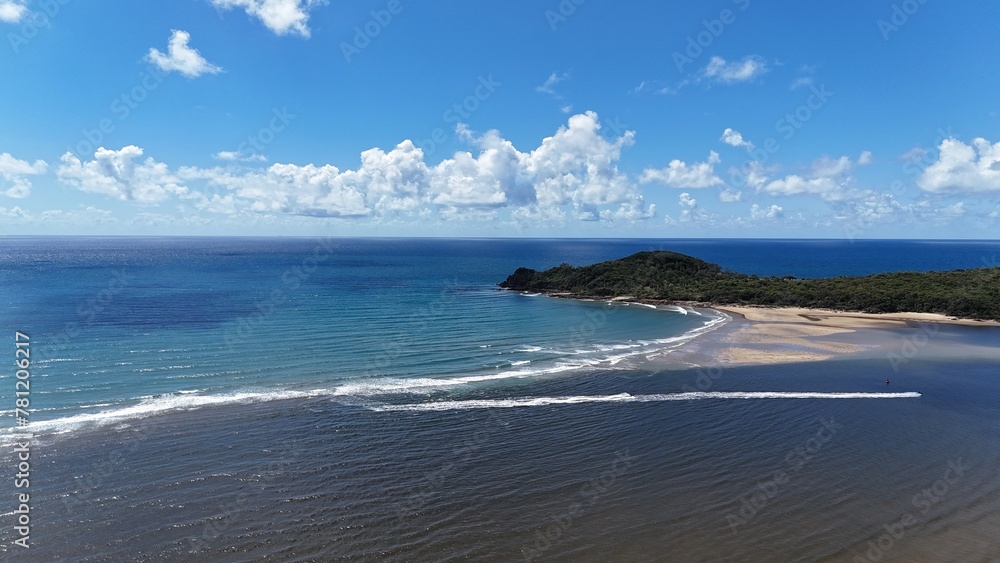 Sticker Sandy beach with gentle waves lapping at the shore