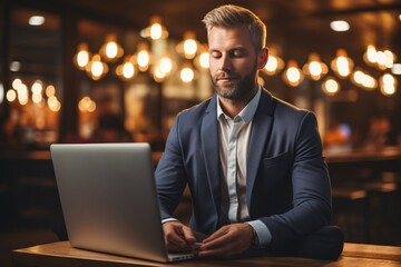 Happy businessman sitting on table in office practising yoga