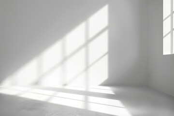 Obraz premium A room with a large window that is letting in a lot of sunlight. The room is empty and has a very clean and bright appearance
