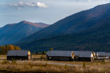 Rural buildings against the background of mountains. Xinjiang, China.