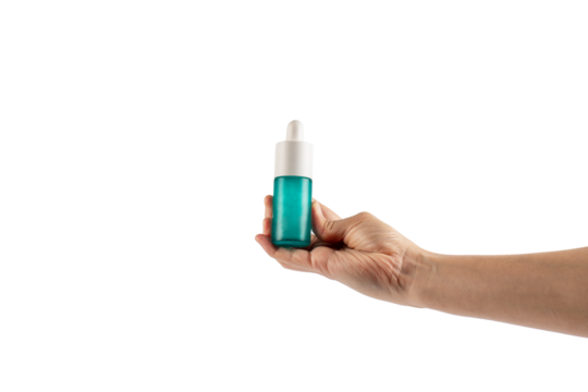 Blue glass cosmetic bottle in hand, Skin care or sunscreen cosmetic on transparent background.