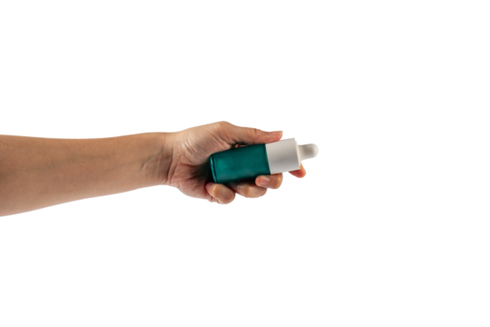 Blue glass cosmetic bottle in hand, Skin care or sunscreen cosmetic on transparent background.