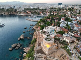 Beautiful view of a rocky shore of an island with buildings in Antalya, Turkey