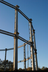 Large Cast Iron Victorian Gas Holder seen against Blue Sky