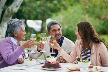 Senior, parents and woman in garden, champagne and outdoor for celebration of anniversary for...