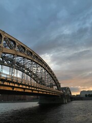 Bolsheokhtinsky bridge over the river during the sunset in Saint Petersburg, Russia