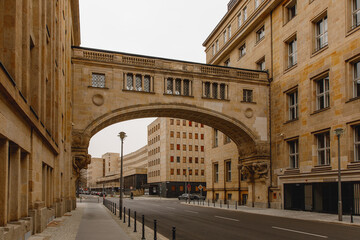 The elegant stone bridge connecting two buildings over a quiet city street