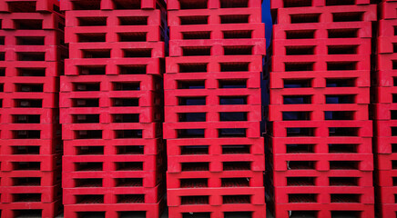 Red pallets arranged in layers