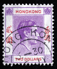 Ukraine, Kiyiv - February 3, 2024.Postage stamps from HONG KONG.A stamp printed in Hong Kong shows image of King George VI, circa 1953.Philately.