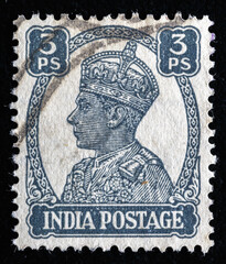 Ukraine, Kiyiv - February 3, 2024.Postage stamps from India.A post stamp printed in India shows portrait of George VI (1895 -1952). Philately. - obrazy, fototapety, plakaty
