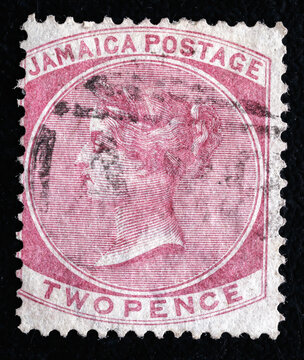 Ukraine, Kiyiv - February 3, 2024.Postage stamps from JAMAICA.An 2 pence rose postage stamp showing portrait of Queen Victoria. She was Queen of the United Kingdom. .Philately.