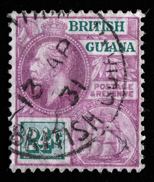Ukraine, Kiyiv - February 3, 2024.Postage stamps from BRITISH GUIANA.A stamp printed in the BRITISH GUIANA shows King George V, circa 1913.Philately.Postage stamps from different countries and times