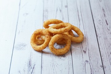 Onion rings on a wooden table