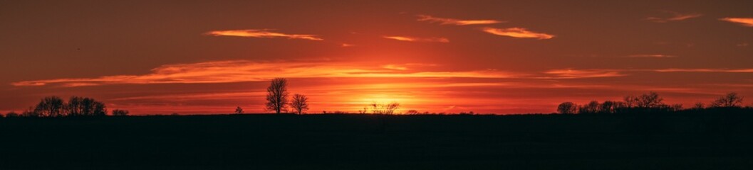 Panoramic landscape of sunset on the farm