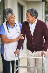Fototapeta premium Nurse, person with disability and walker with talking at retirement home or outside, care and stethoscope. Disabled retiree and medical or outdoors for support or plan, healthcare or conversation