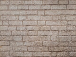 Texture of vintage brick mortar wall as background.