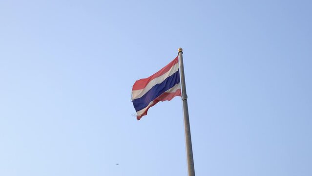 Waving flag of Thailand on blue sky