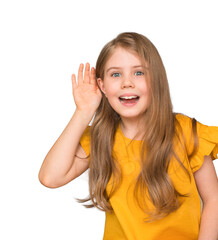 Cute girl pricking up her ear against white background. Cute little girl listens and making hand to ear gesture. Isolated on white background. Space for text
