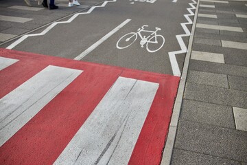 marking a pedestrian crossing on the asphalt of a bicycle path