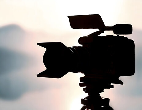Silhouette of a professional studio video camera. Preparation and release of news.