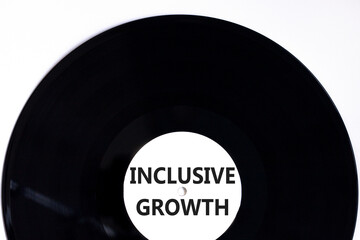 Inclusive growth symbol. Concept words Inclusive growth on beautiful black vinyl disk. Beautiful white table white background. Business inclusive growth concept. Copy space.