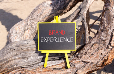Brand experience symbol. Concept words Brand experience on beautiful black yellow blackboard....